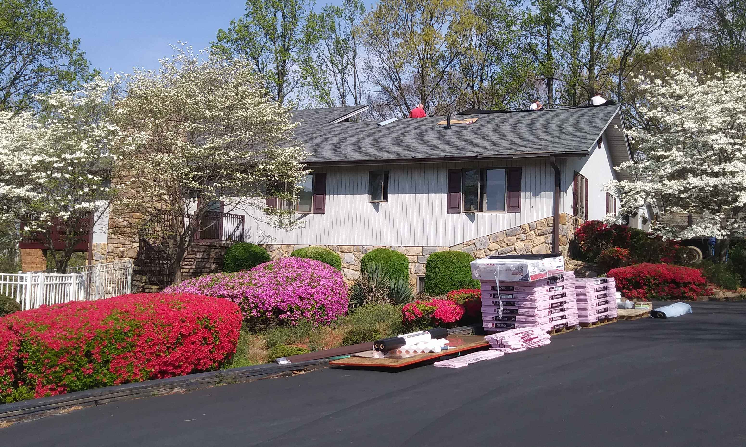 A new roof being installed on a single-family home