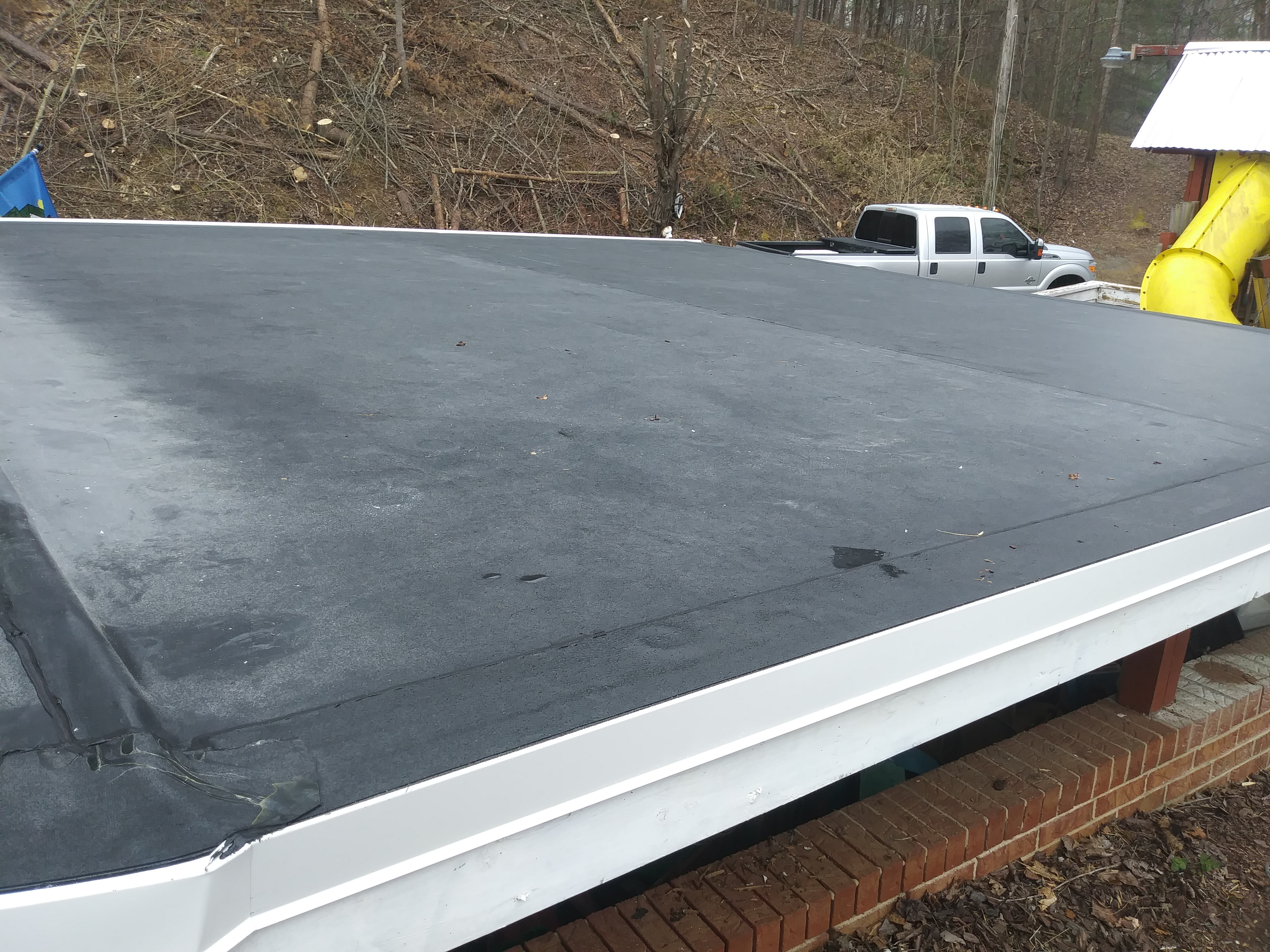 Wood being replaced on an opened roof