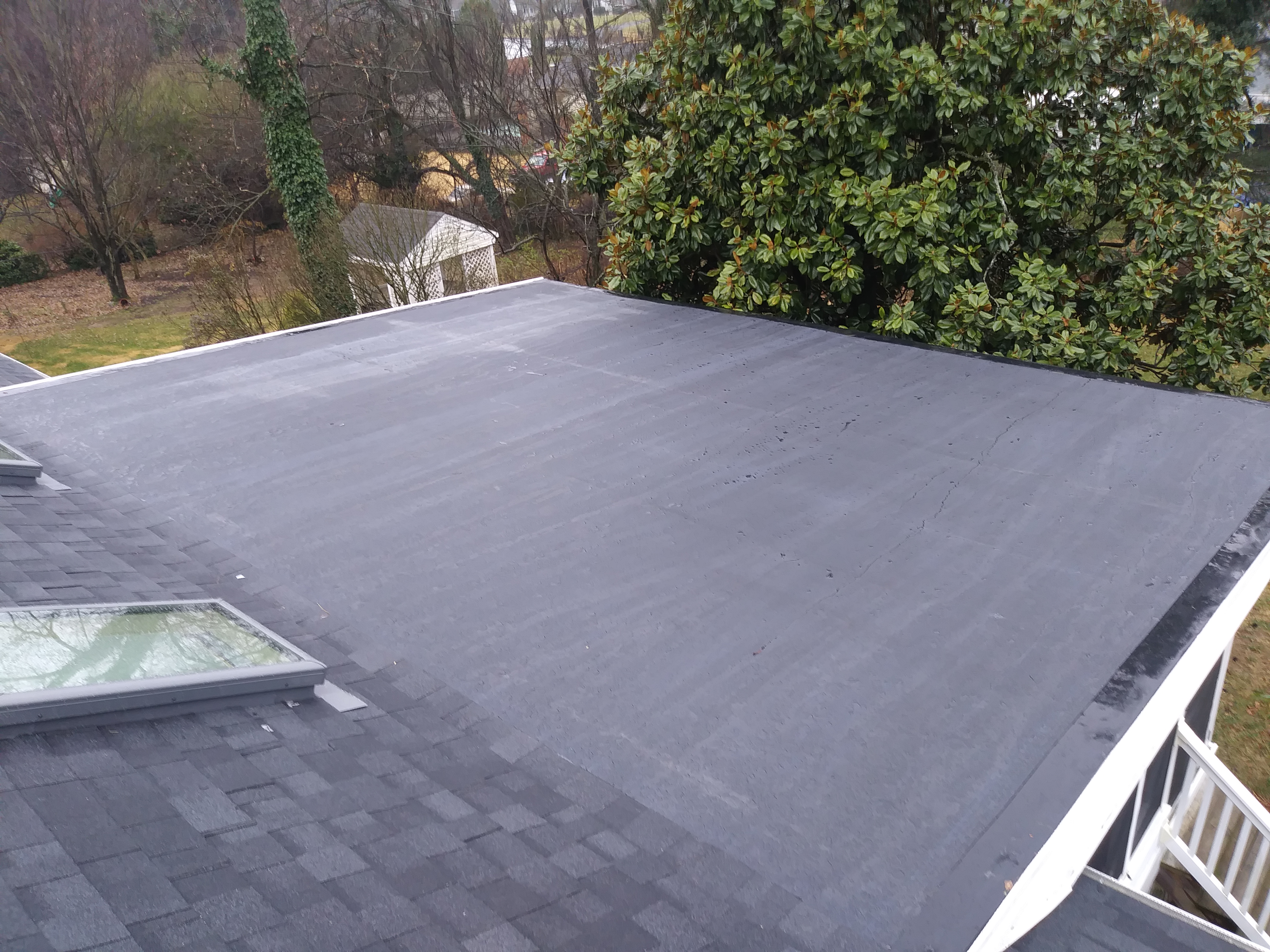 A new rubber roof installed over a sun room